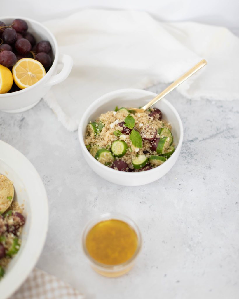 bowl of minted feta quinoa salad with grapes and cucumber