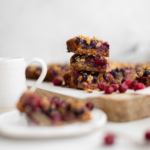 homemade almond berry breakfast bars cut into squares and stacked