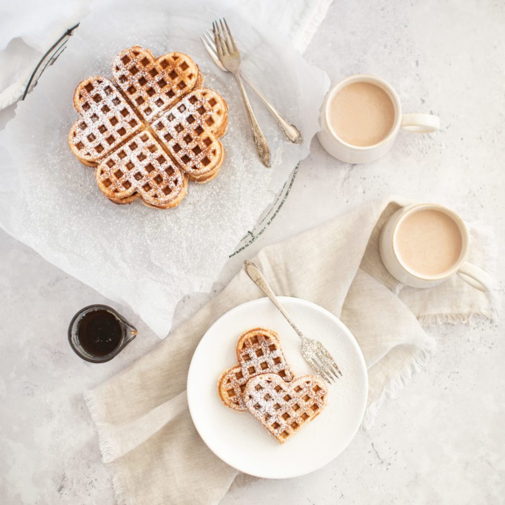 Homemade eggnog waffles with syrup and coffee