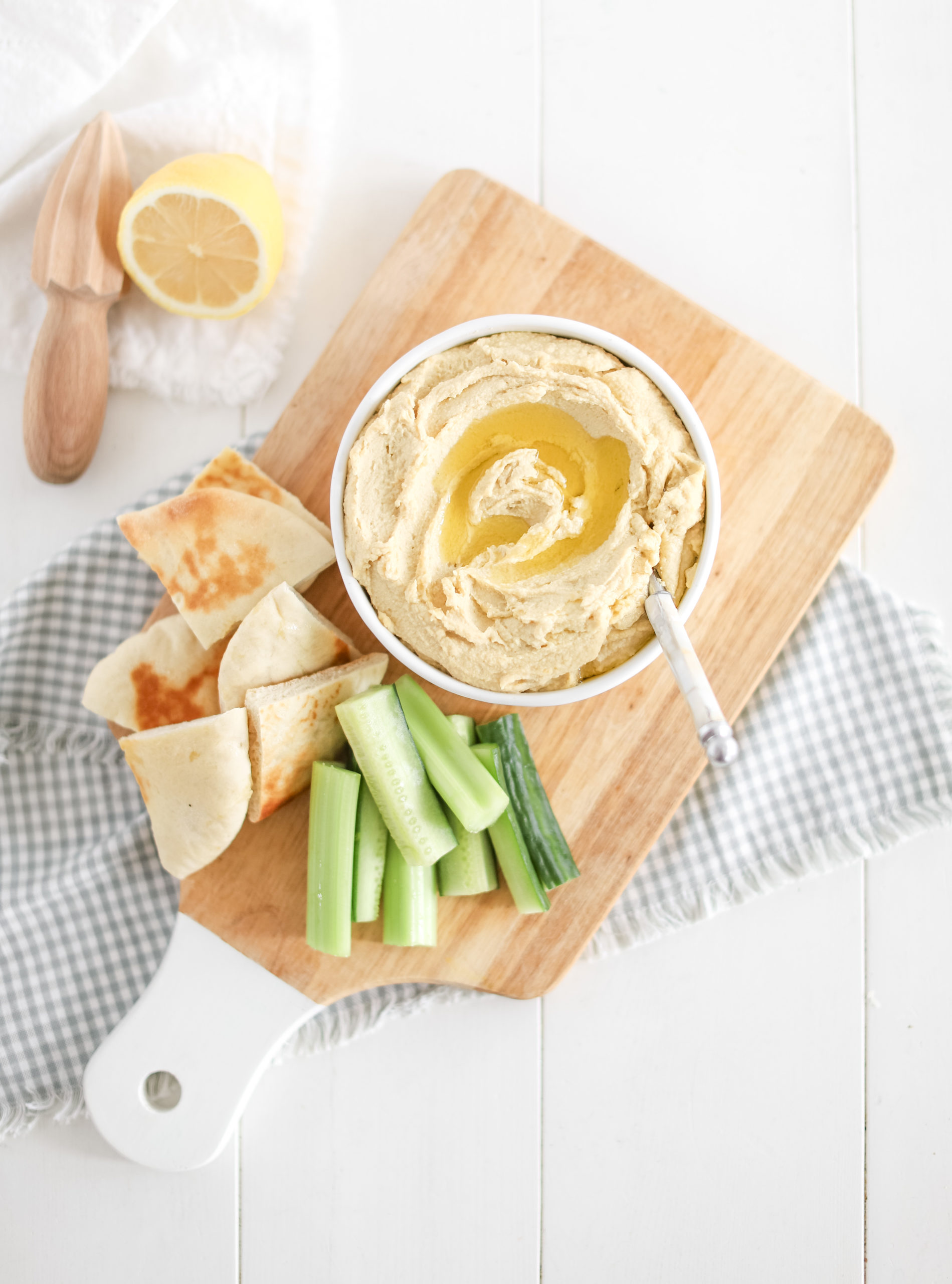 hummus served with pita and vegetables