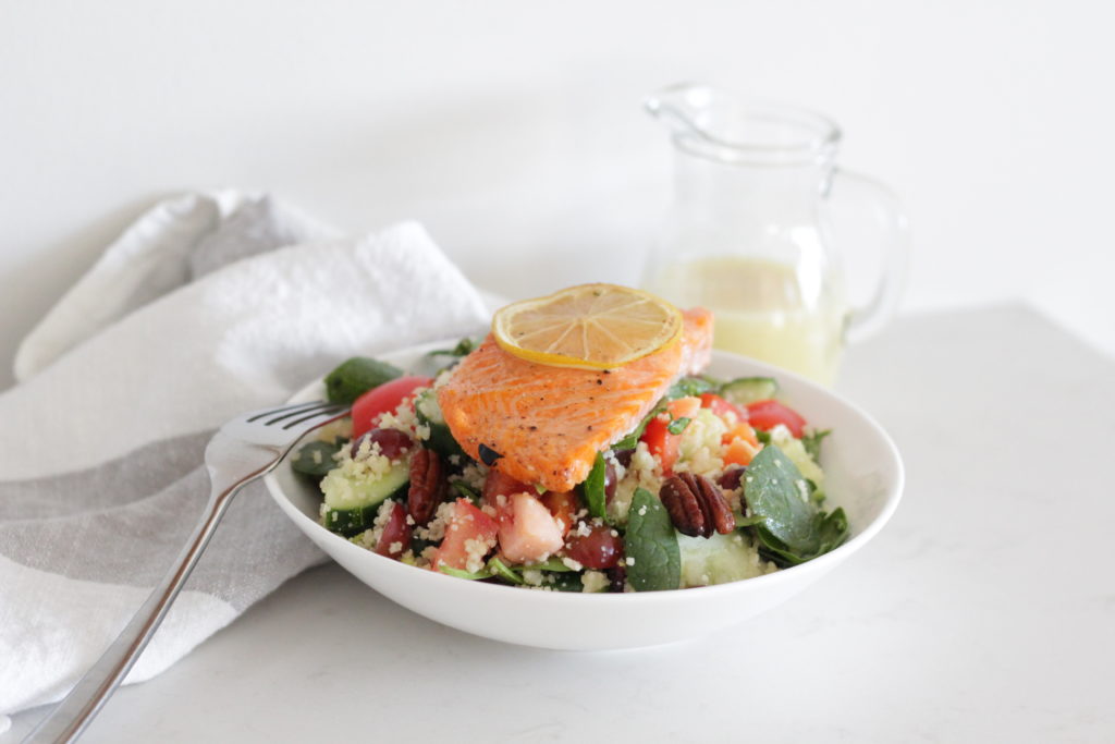 Salad topped with salmon fillet 