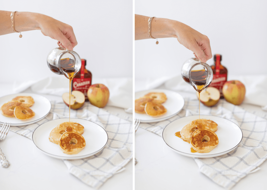 hand pouring maple syrup over Apple Ring Pancakes on a white plate