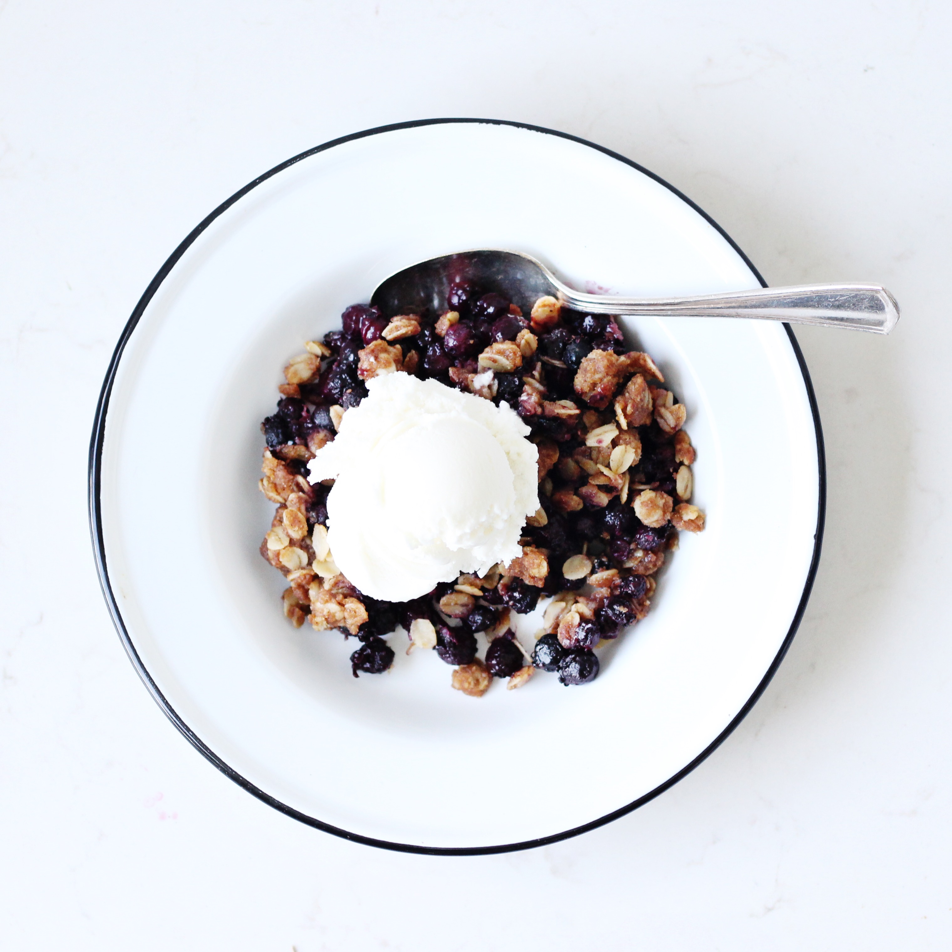 Berry Crisp topped with ice cream
