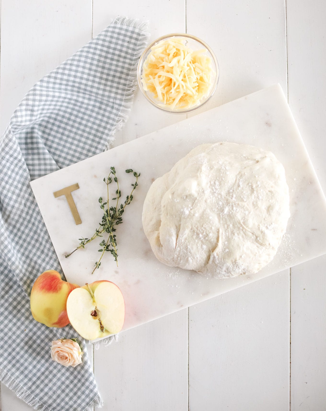 pizza dough with apples and cheese