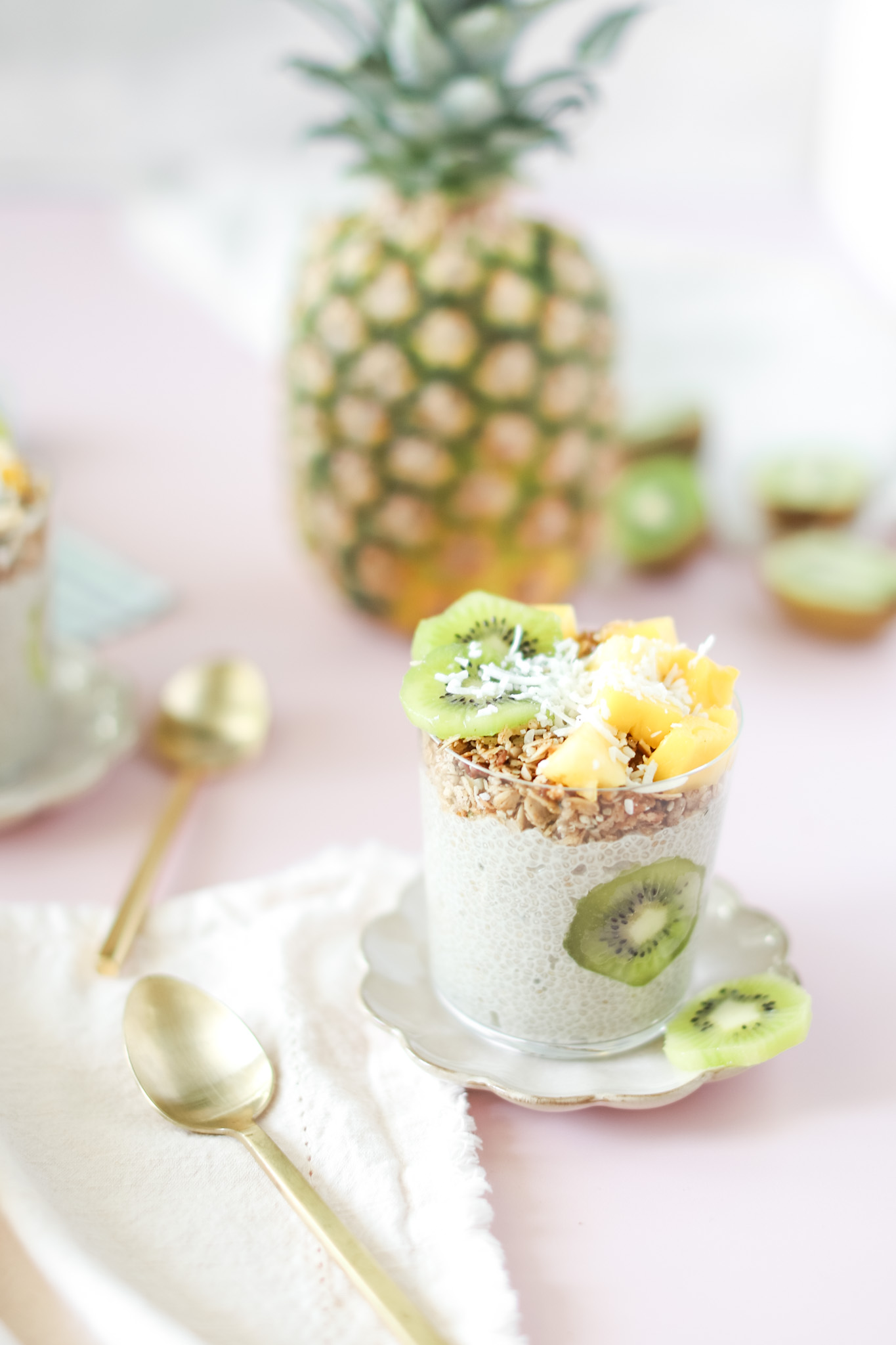 Tropical Chia Pudding with kiwi, pineapple and coconut flakes