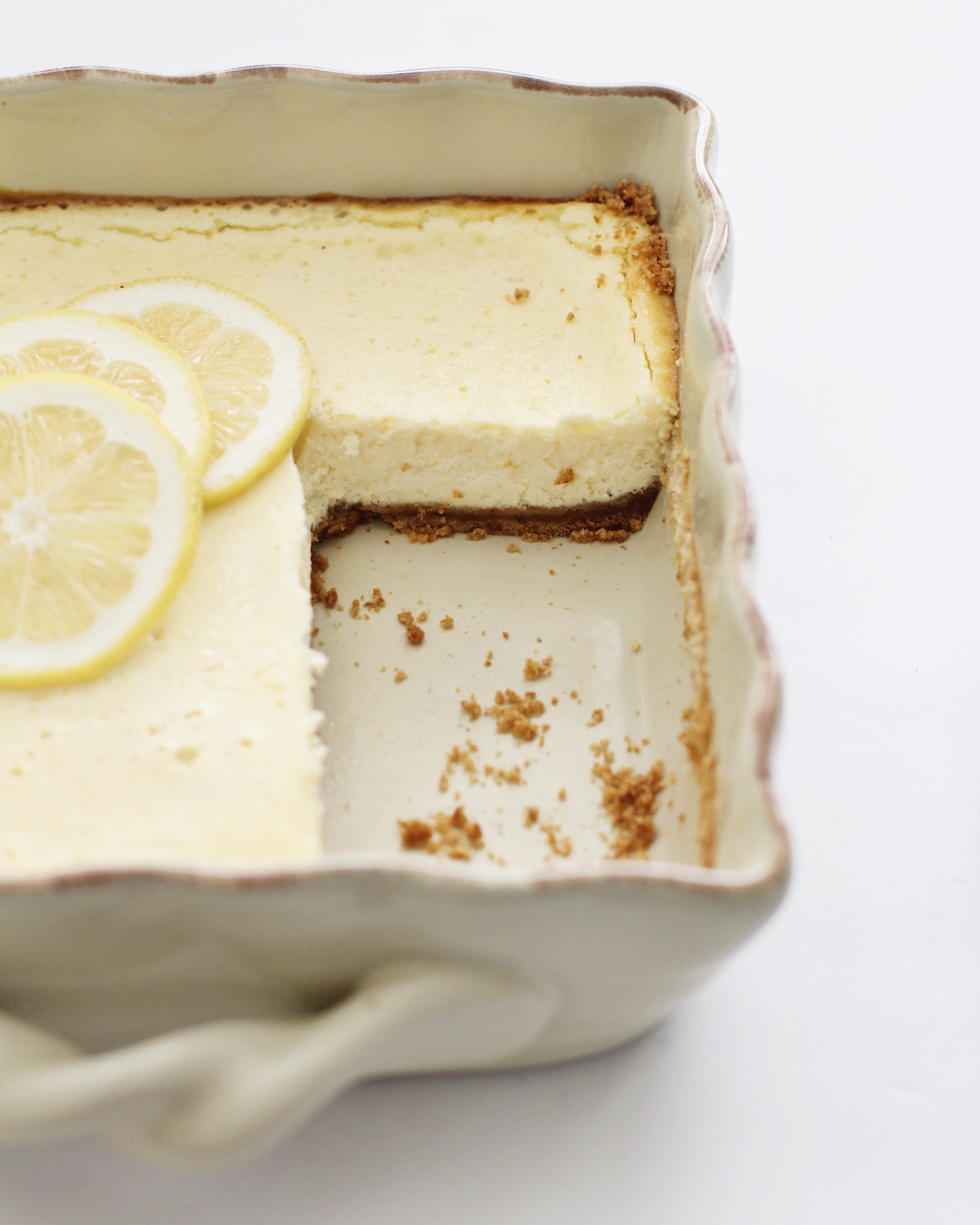Easy Lemon Cheesecake Squares in serving dish 
