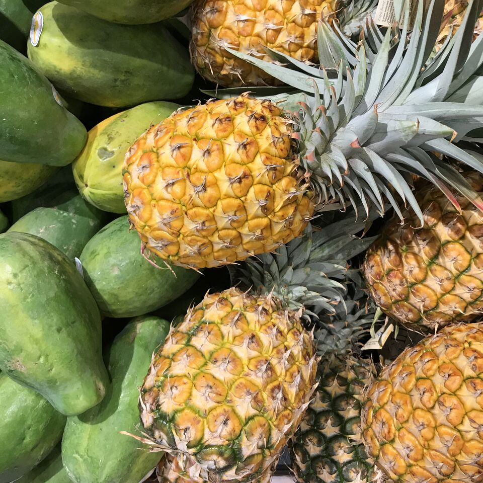 Fresh papaya and pineapple from the shores of O'ahu in Hawaii