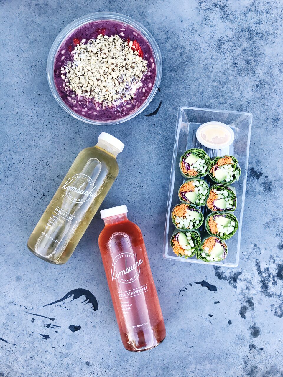 Lunch from Whole Foods in O'ahu complete with veggie spring rolls, acai bowl and kombucha 