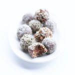 hemp heart coated gingerbread energy bites in a white bowl