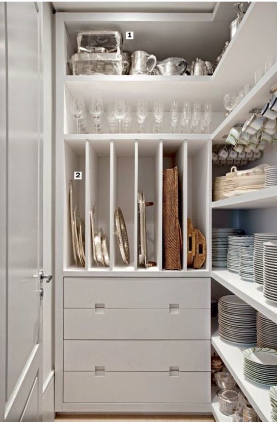open shelving with hooks for espresso cups, slots for baking sheets and platters