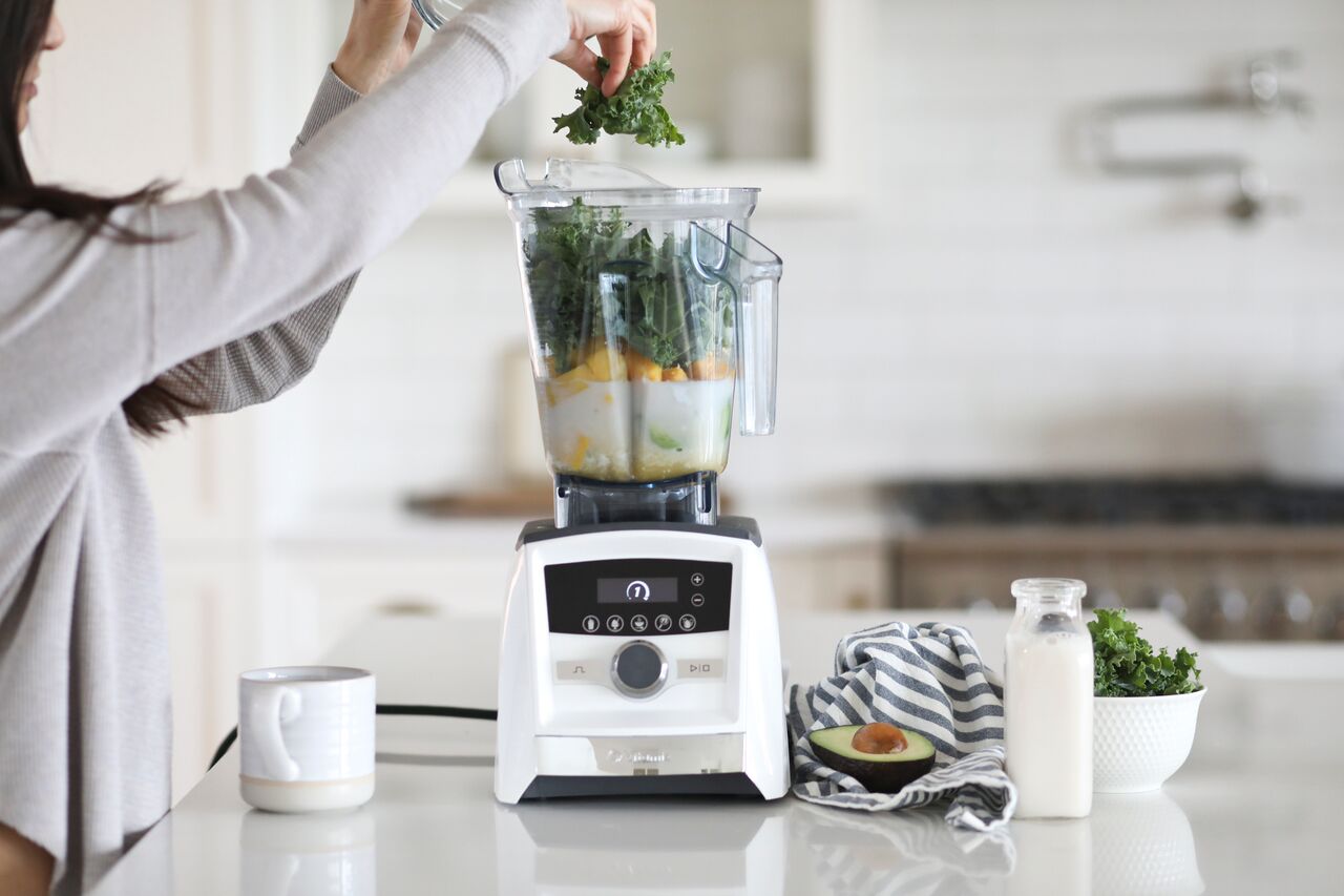 Dietitian's Green Smoothie that the kids love made in a white Vitamix Ascent Series machine.