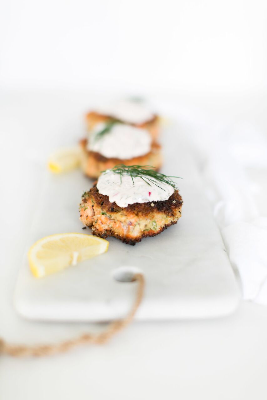 The BEST salmon cakes you will ever eat, made with smoked and fresh salmon and topped with an addictive homemade dill tartar sauce by Fraiche Nutrition.
