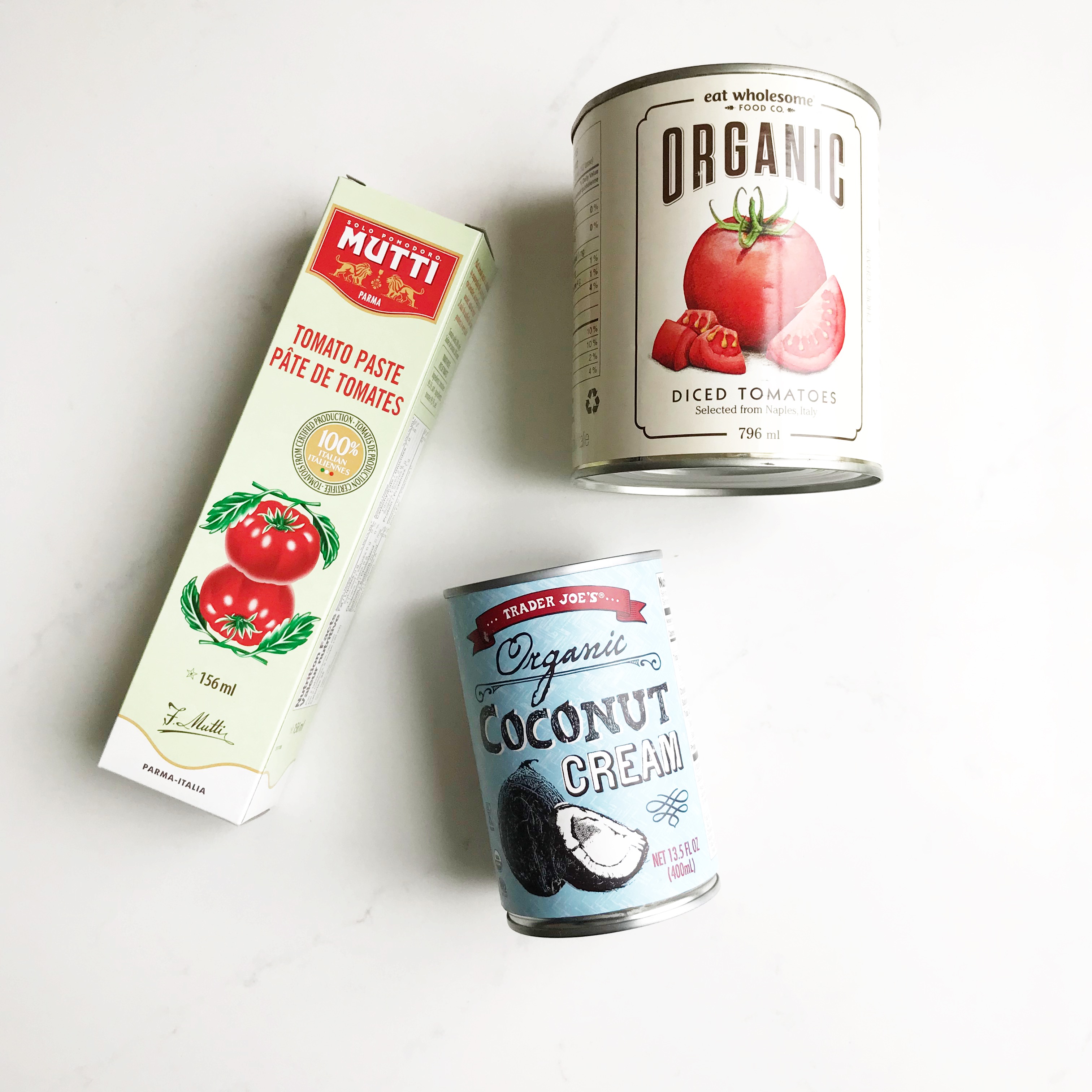 coconut cream, organic diced tomatoes and tomato paste: some of my must have condiments!