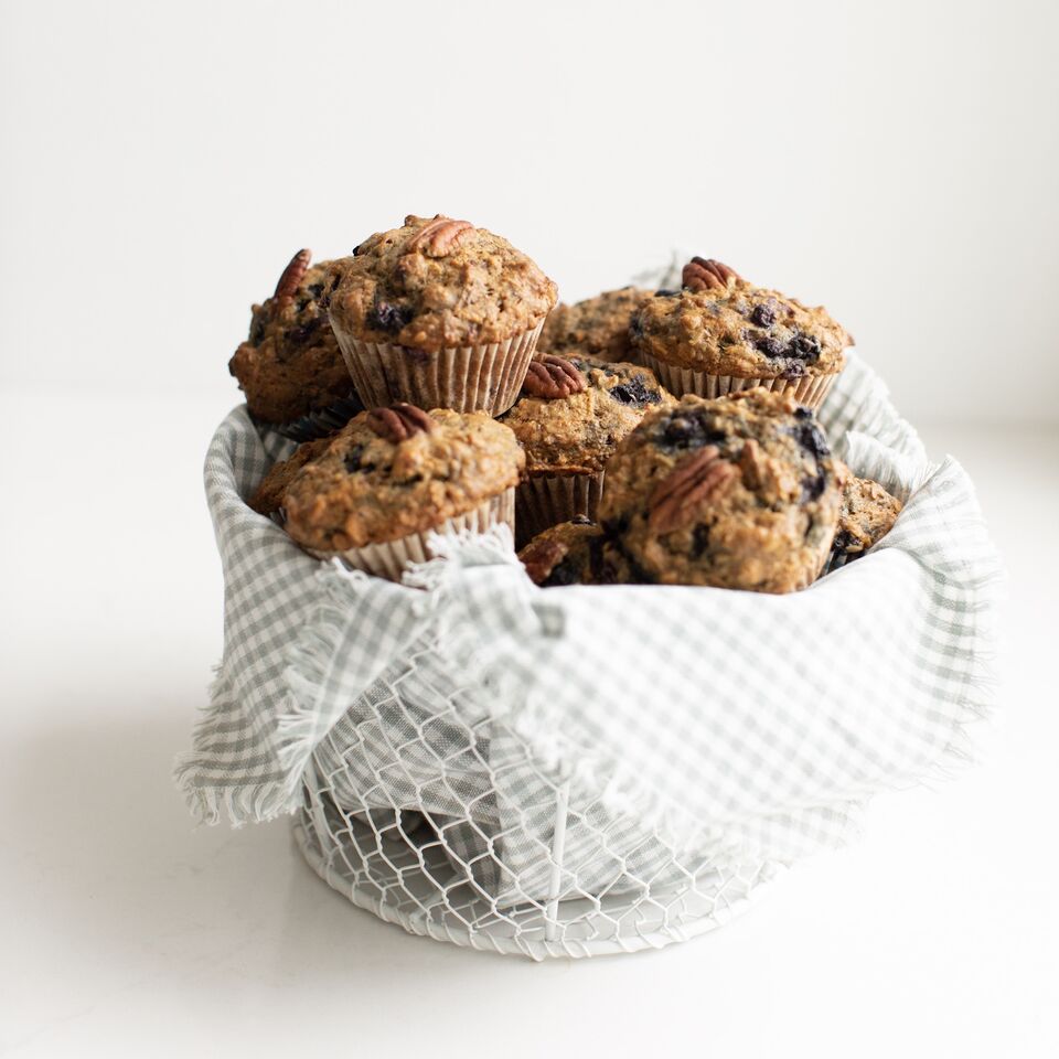 A basket full of Sneaky Mommy Muffins: Designed by a Registered Dietitian, these "Fruit and veggie" muffins filled with healthy vegetables, fibre, lightly sweetened with a vegan option! These freeze beautifully.