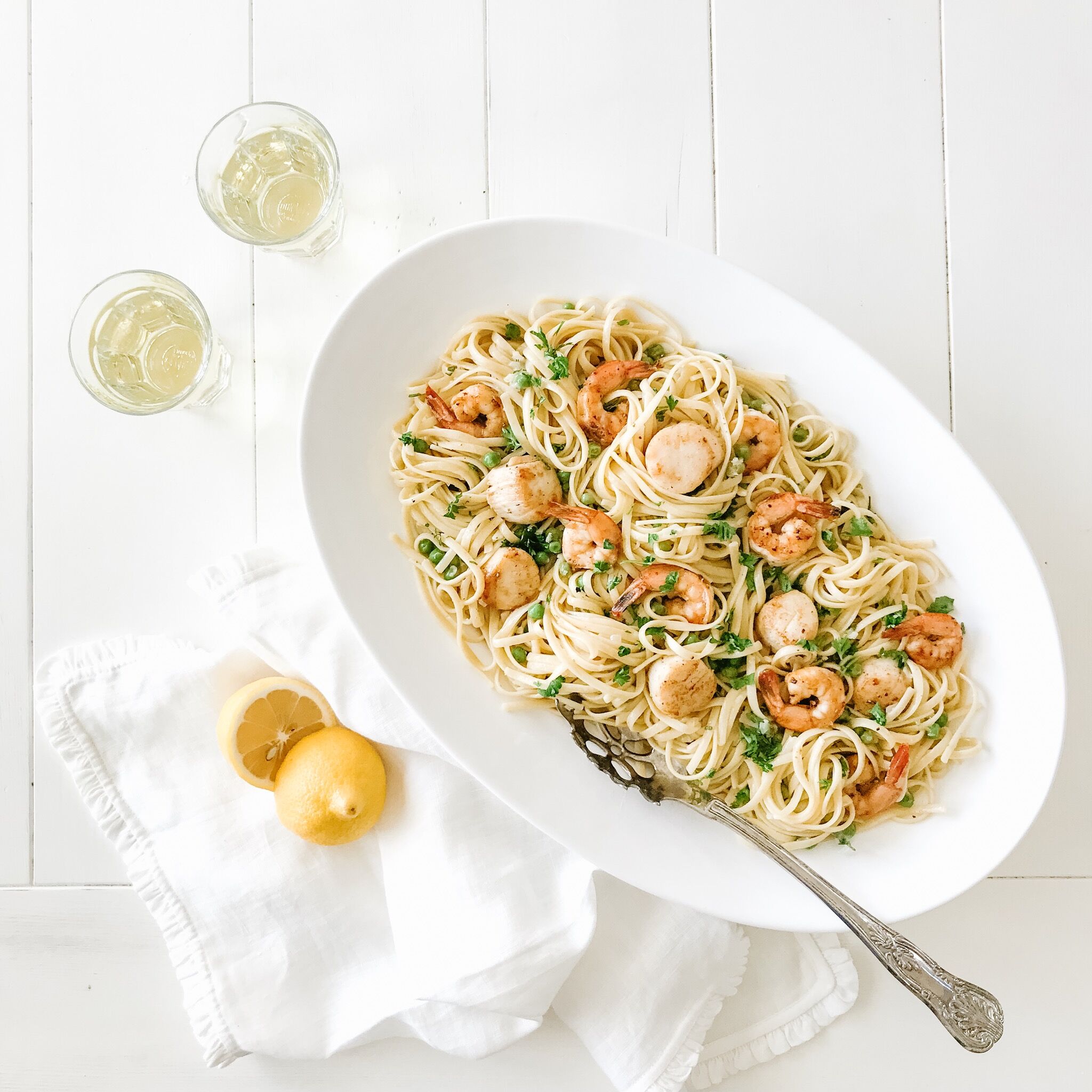 Seafood Linguine in a platter served with crisp white wine