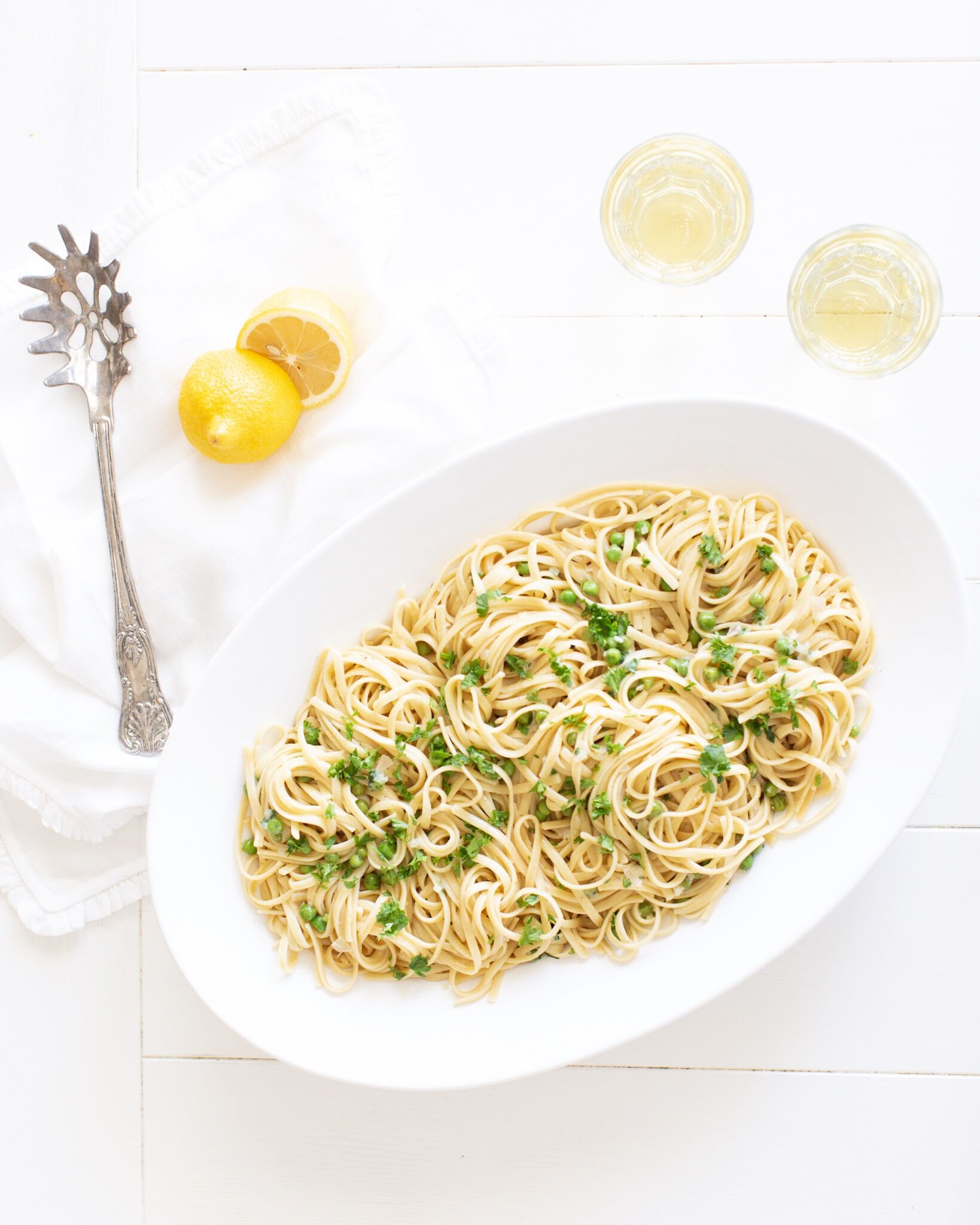 Spring Linguine with a vegetarian option served in a platter served with crisp white wine