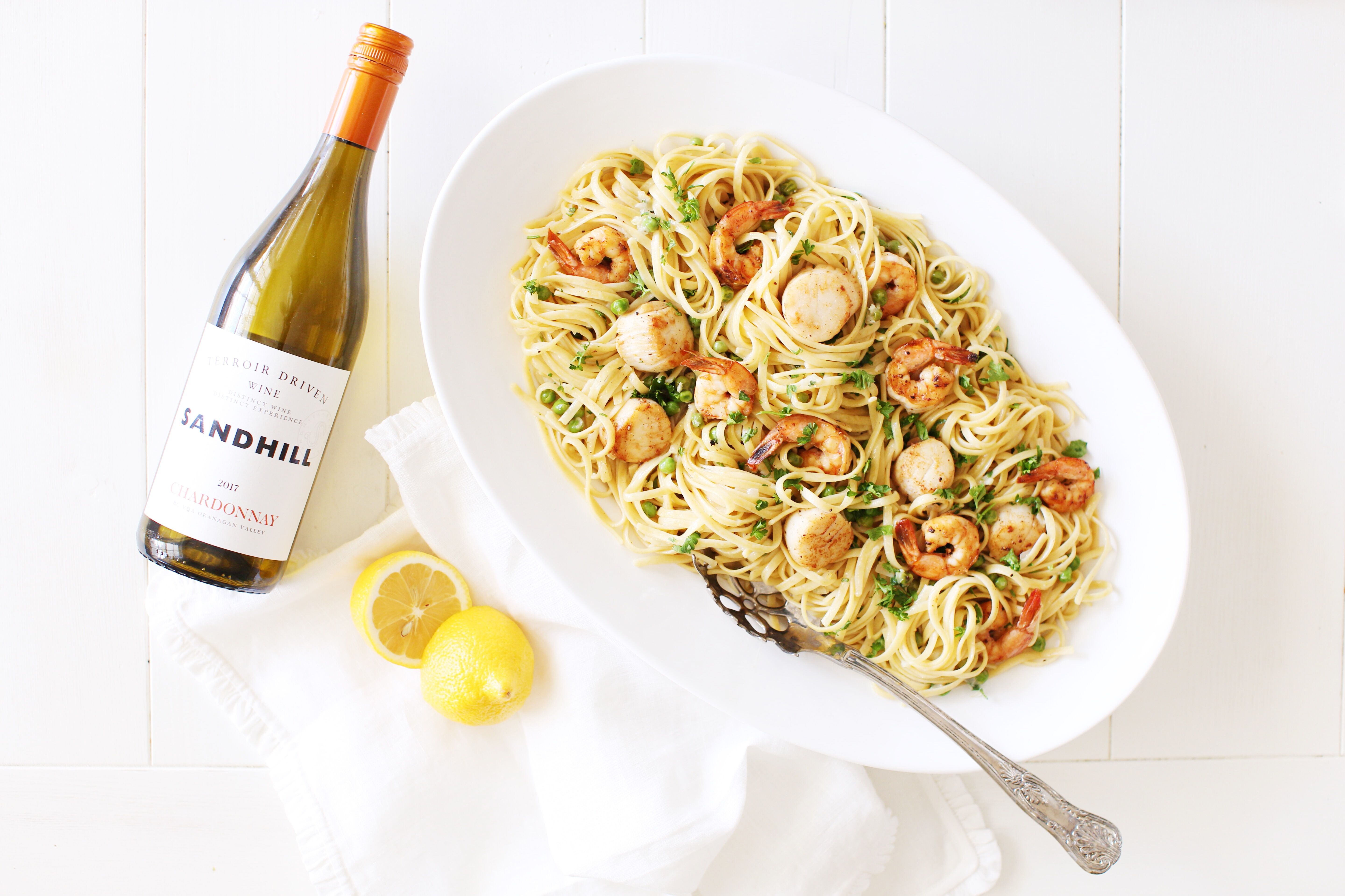 Seafood Linguine in a platter served with crisp white wine