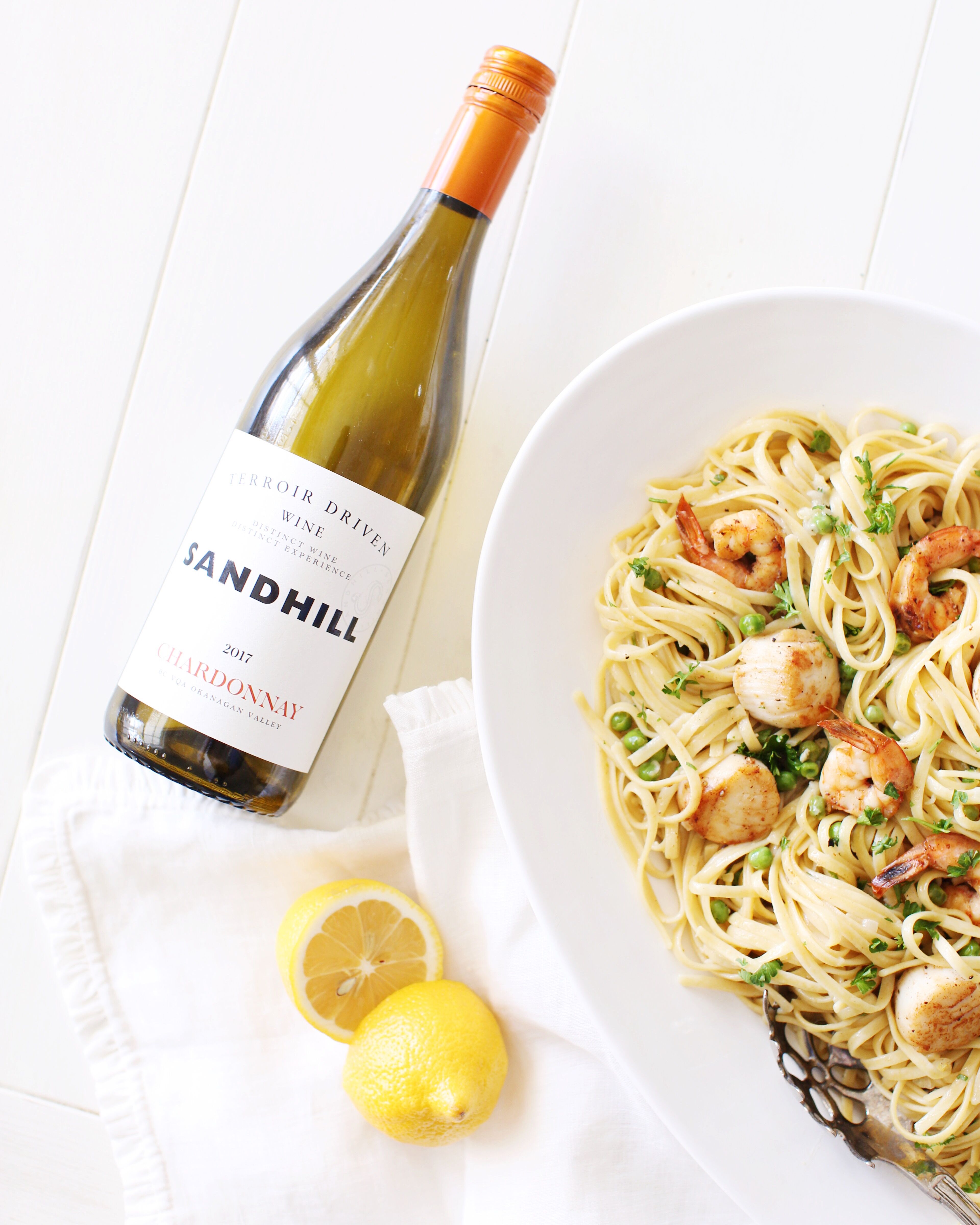 Seafood Linguine in a platter served with crisp white wine