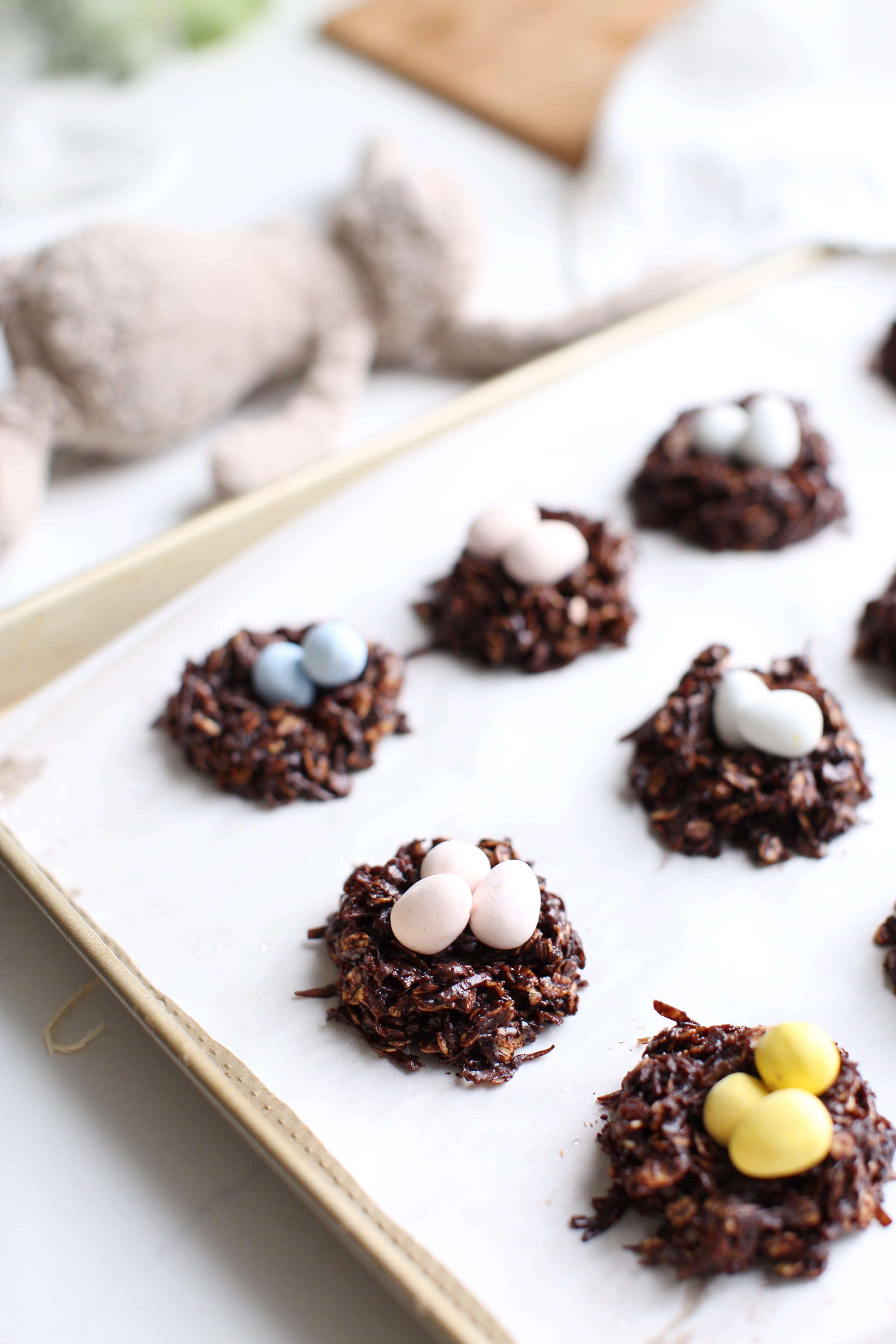 Healthy Chocolate Haystack Cookies that are naturally sweetened, vegan and gluten free. They also make adorable 'nests' for mini chocolate eggs for Easter!