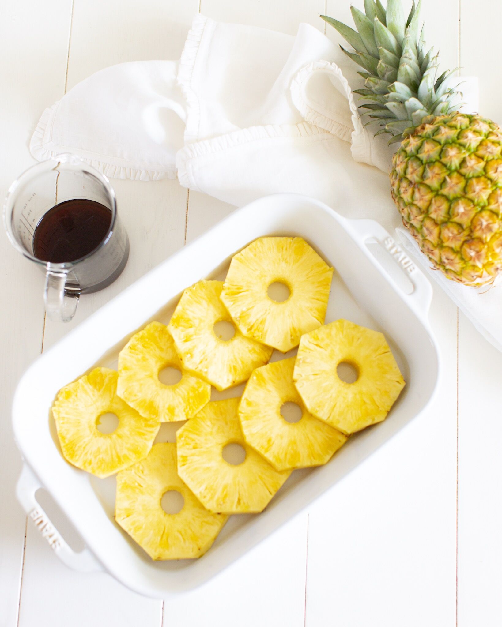 Cut Pineapple rings in white baking dish