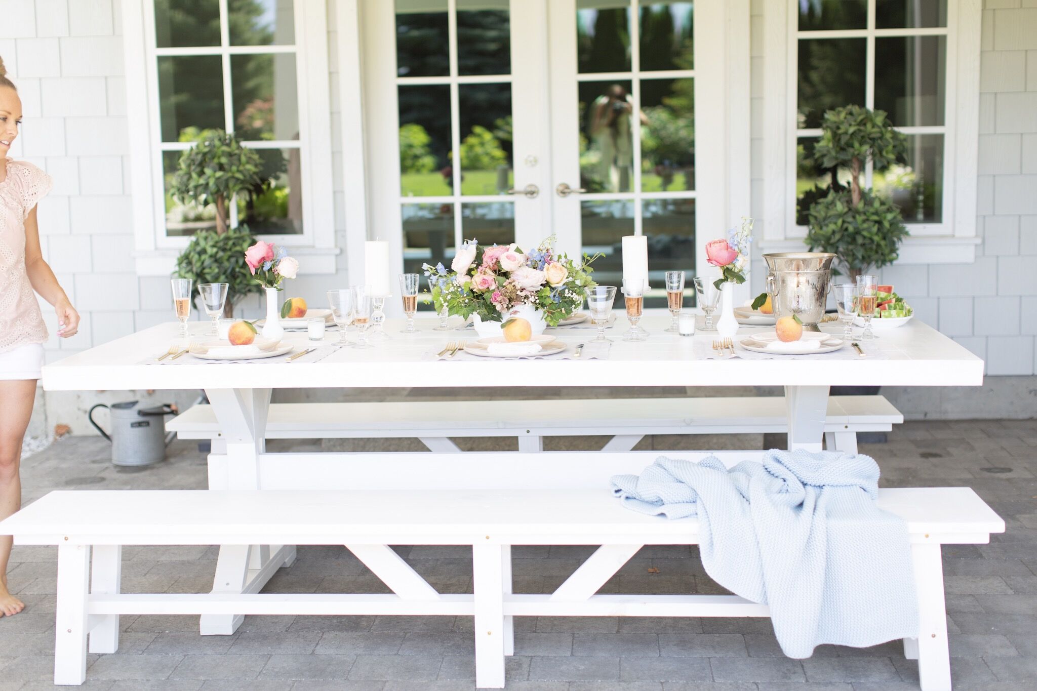 How to throw the best garden party complete with a white picnic table, a wine-paired menu, fresh flowers and a hostess schedule