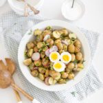 fraiche living french potato salad in a bowl with eggs