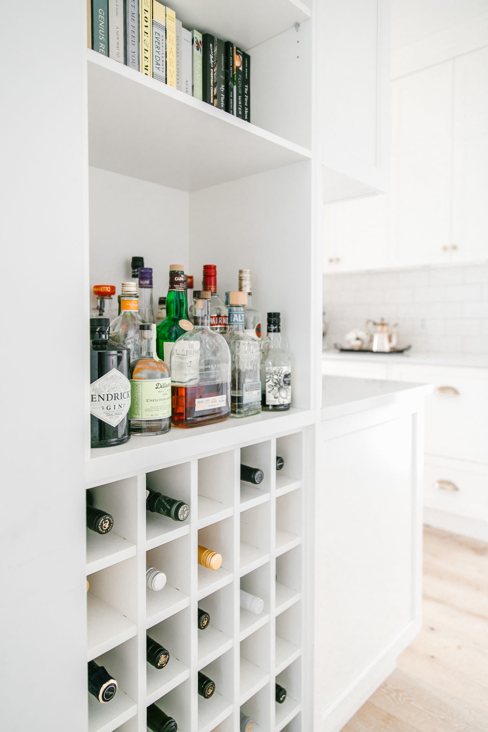 Butler pantry with a bar area for storing wine, spirits and cookbooks.