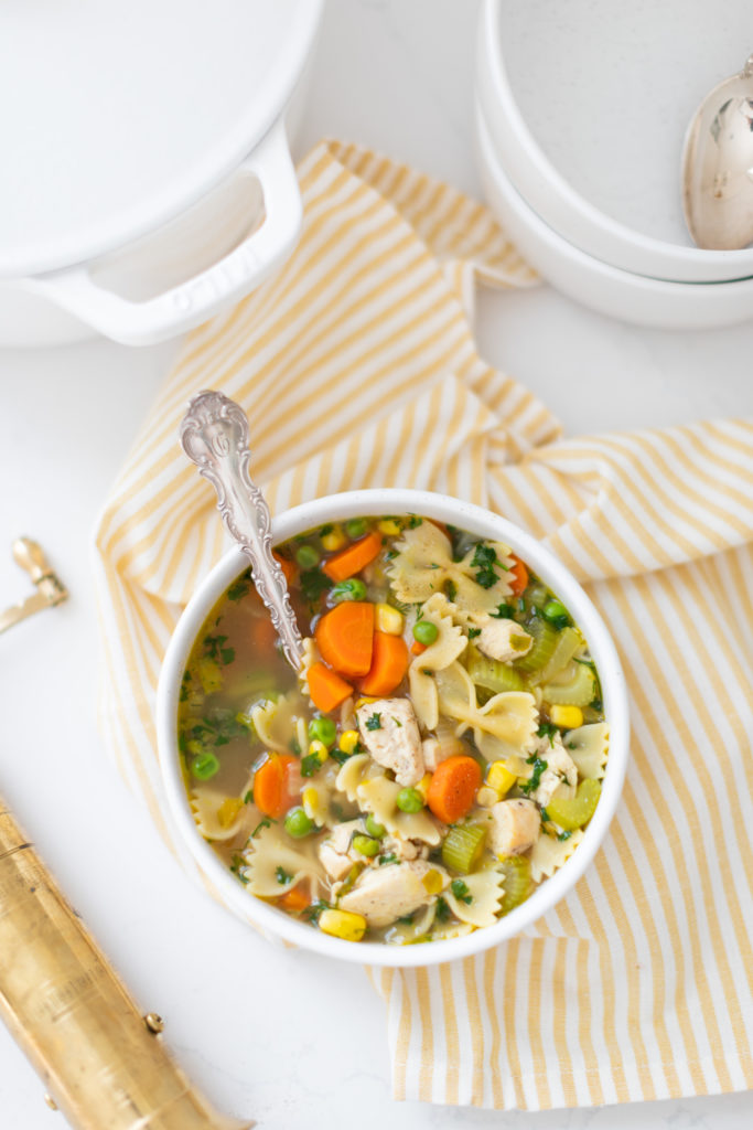 Turkey Soup with vegetables in a bowl with a spoon