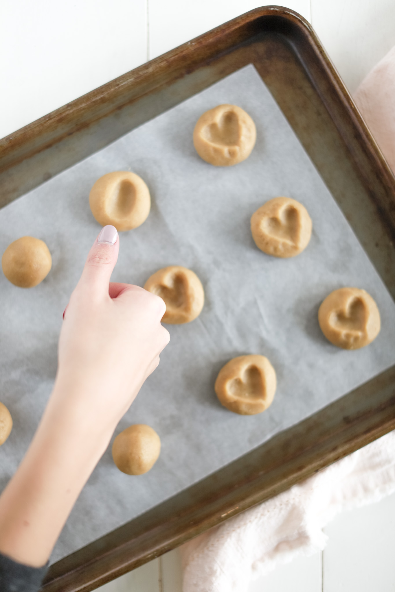 make a thumbprint cookie with your thumb
