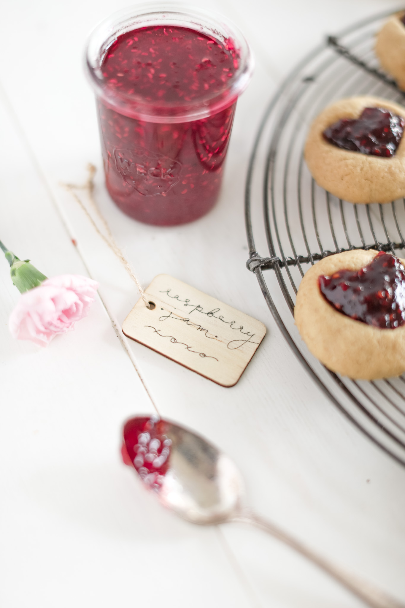 jar of raspberry jam for thumbprint cookies
