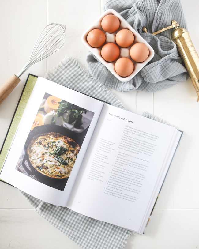 cookbook open to recipe for butternut squash frittata 