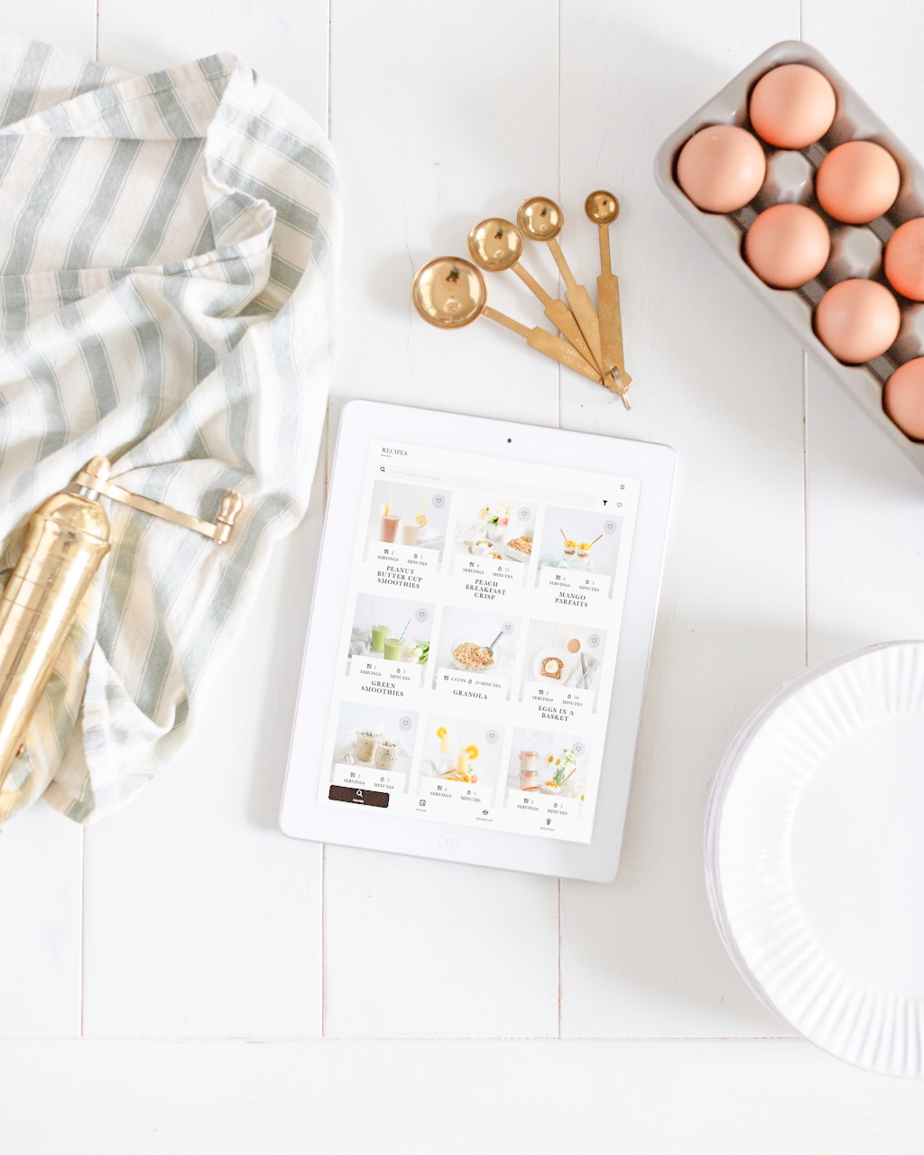 ipad in kitchen with eggs and measuring spoons
