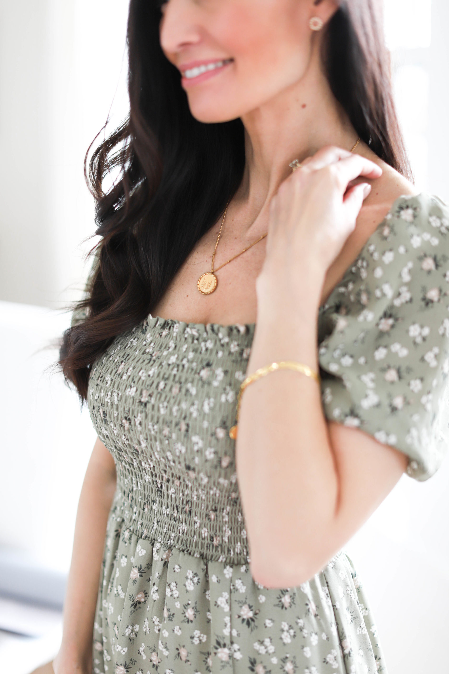 Tori Wesszer from Fraiche Living wearing a green dress and the fraiche x so pretty jewelry 