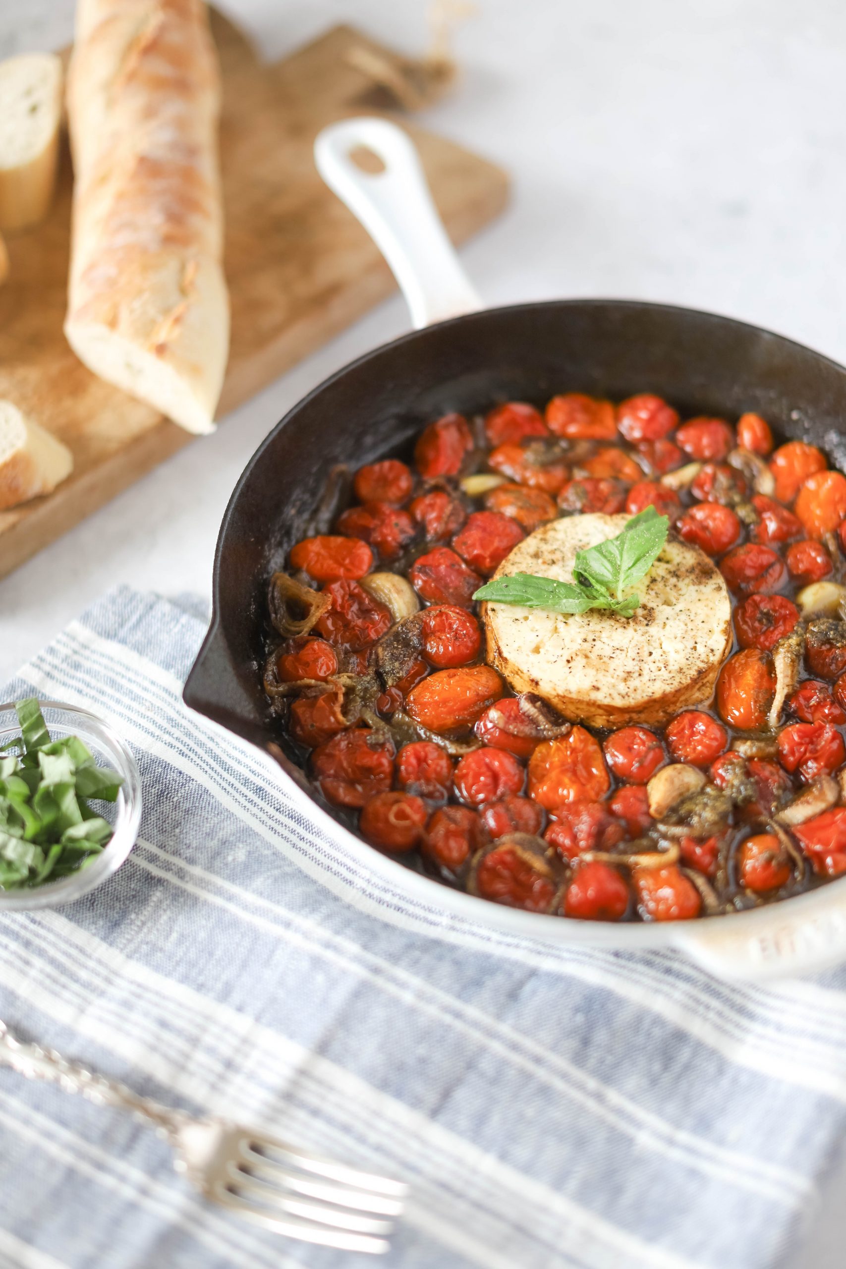 Baked feta dip with roasted tomatoes and basil