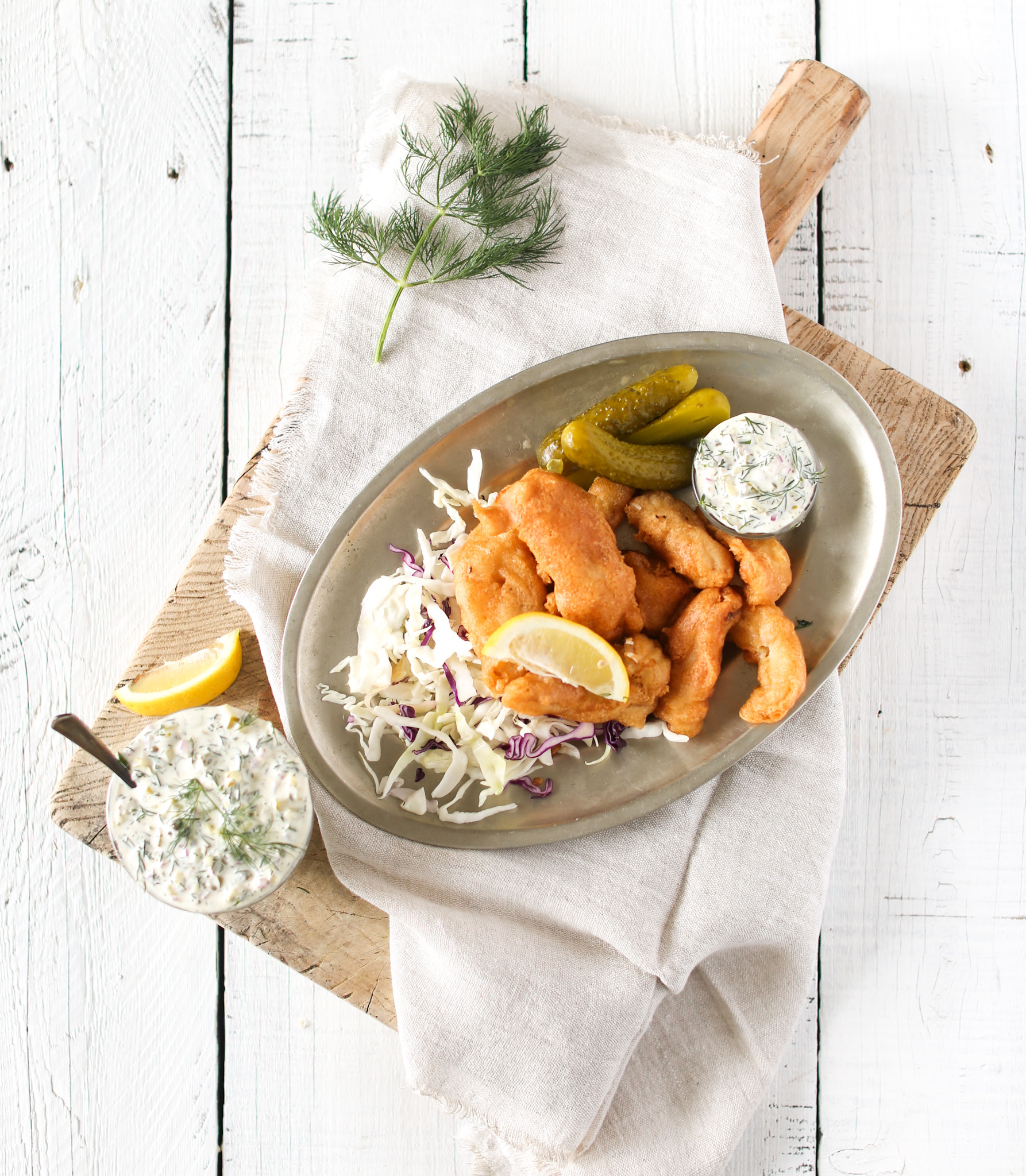 Homemade Dill Tartar Sauce serve with lemon, pickles and fried fish