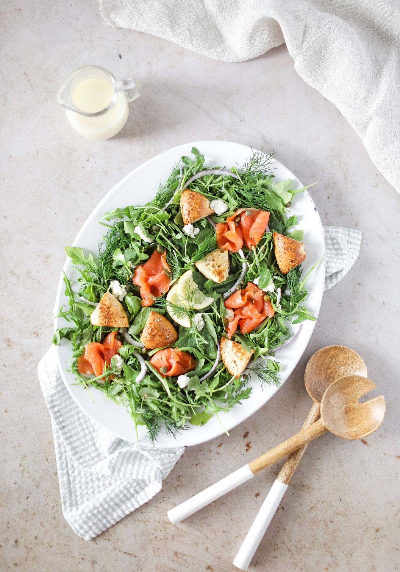 Smoked Salmon Bagel Panzanella Salad in bowl with spoons