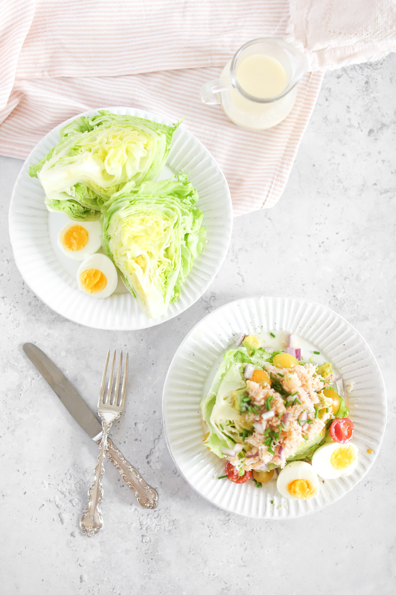 crab wedge salad on two plates with cutlery 