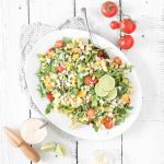 Fraiche Living Grilled Corn Pasta Salad in a bowl with lime