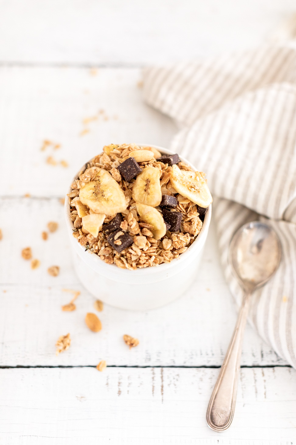 Chunky Monkey Granola by Fraiche Living in a bowl with a spoon