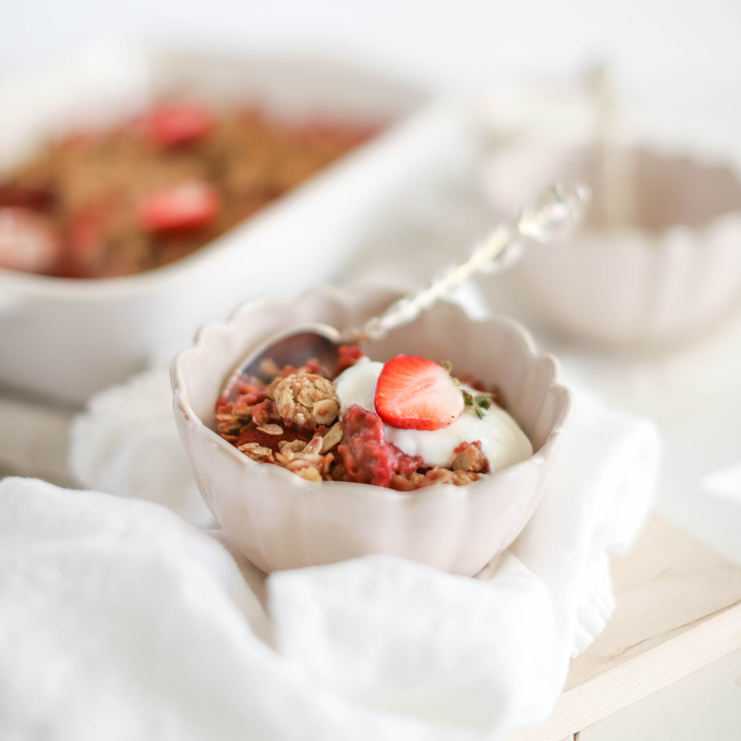Fraîche Table: Strawberry Breakfast Crisp in bowl topped with yogurt