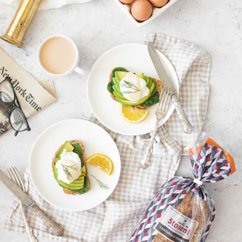 Green Goddess Eggs Benedict with Stonemill Bread on two plates