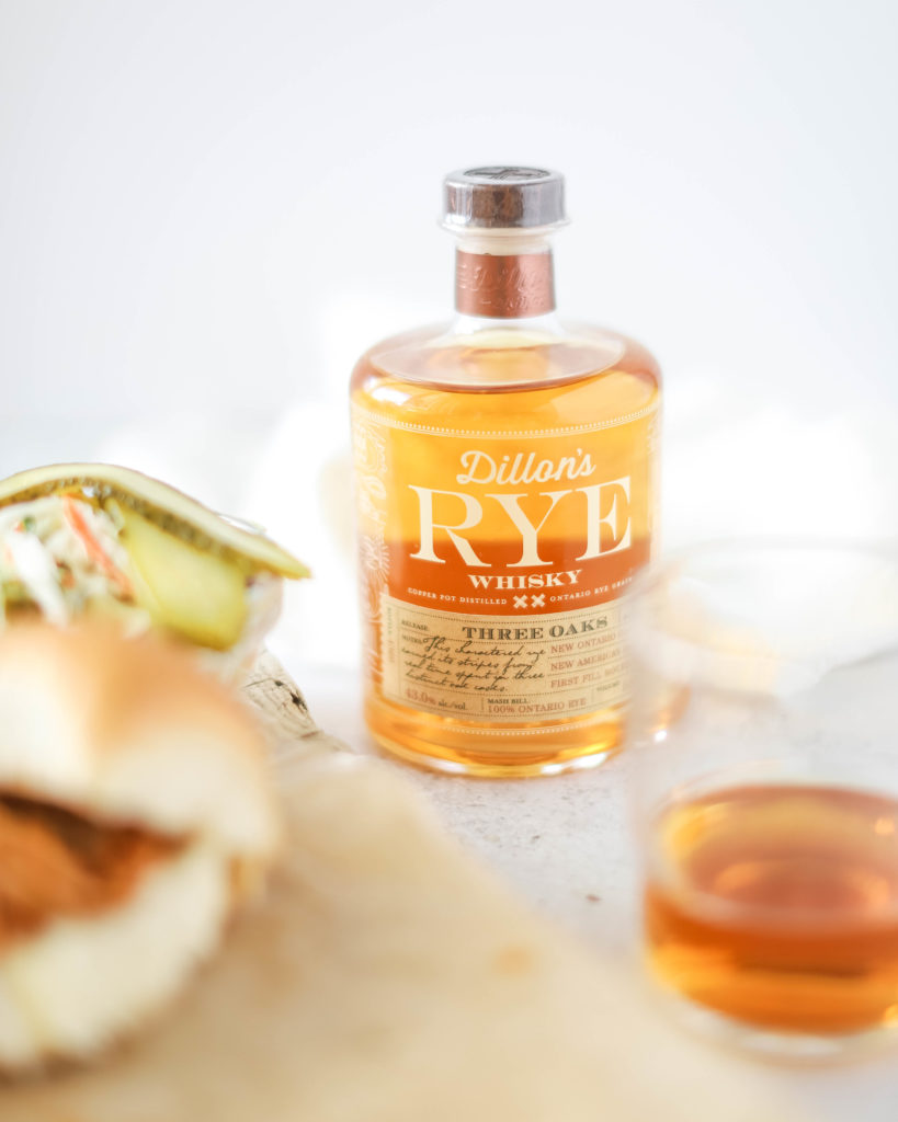 bottle of Dillon's Rye Whiskey to use in the Whiskey BBQ Chicken Crockpot Sliders recipe