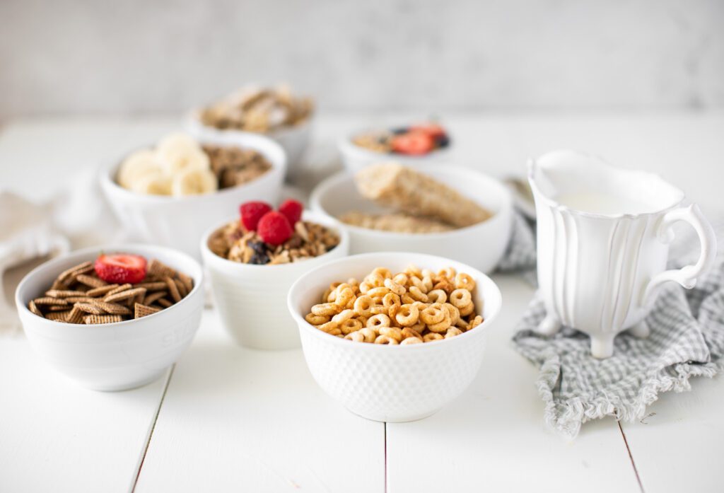 Bowls of cereal types with milk and fruit