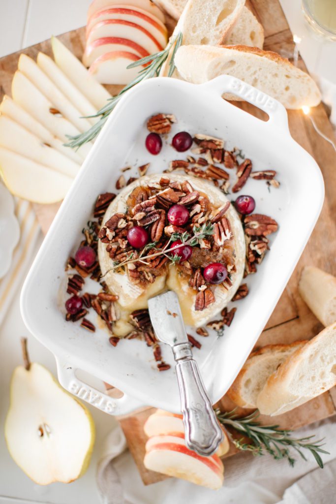 Baked Brie with nuts and berries and baguette slices