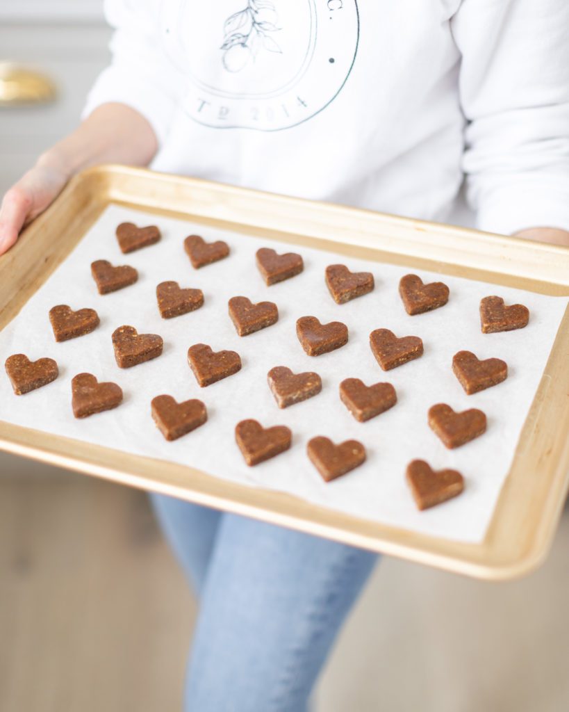 Heart shaped Chocolate Covered Date Turtles on sheet pan