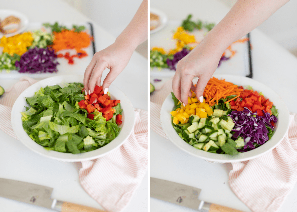 Hand topping a Chopped Salad with fresh veggies 