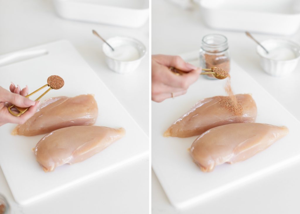 seasoning raw chicken breasts with spices