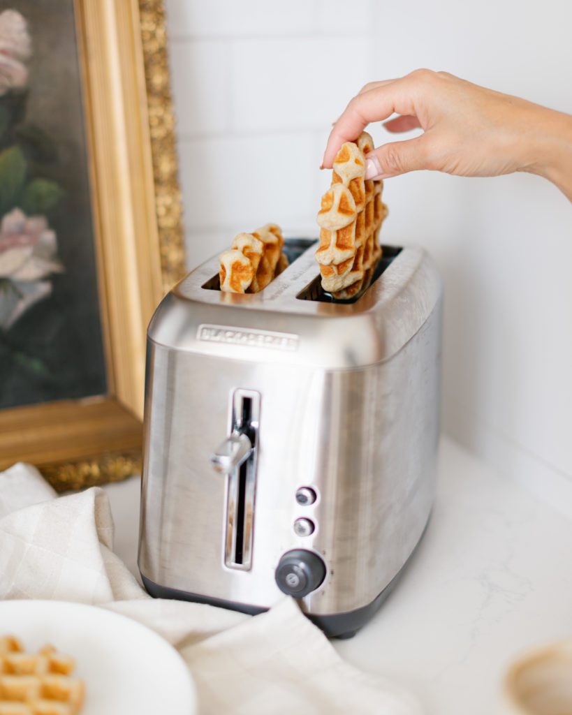 putting waffles into the toaster