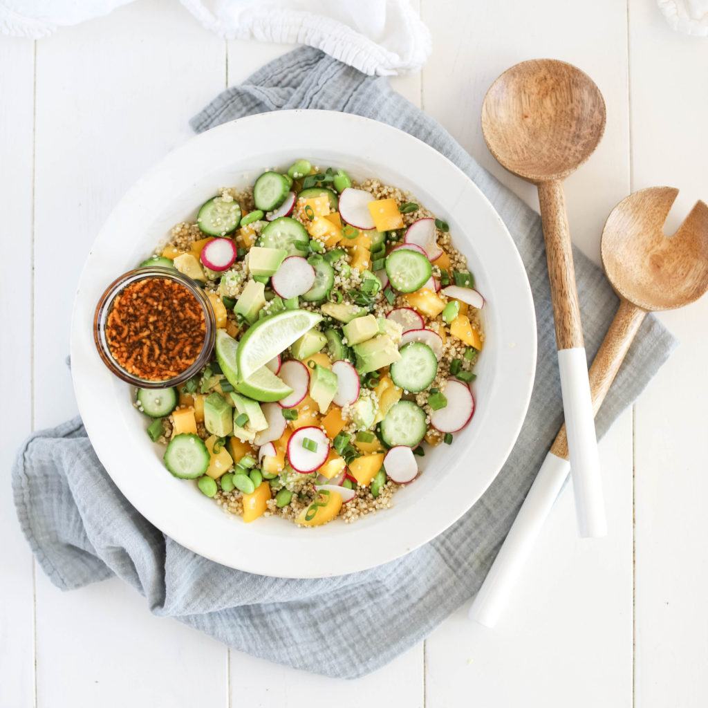 Fraiche Table Sesame Ginger salad in one bowl with avocado, mango, quinoa, and cucumber 
