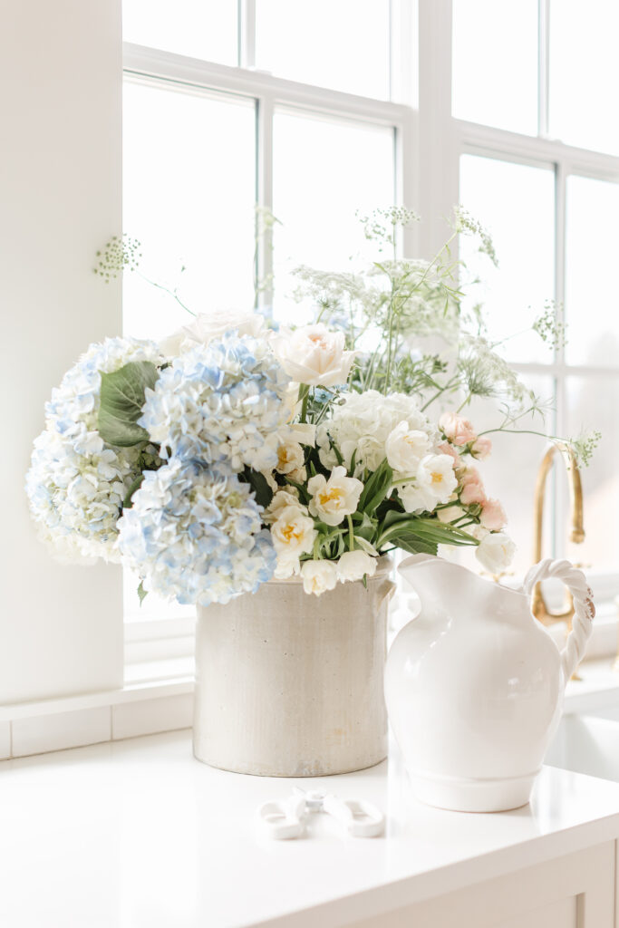 bouquet of blue and white flowers on a kitchen counter
